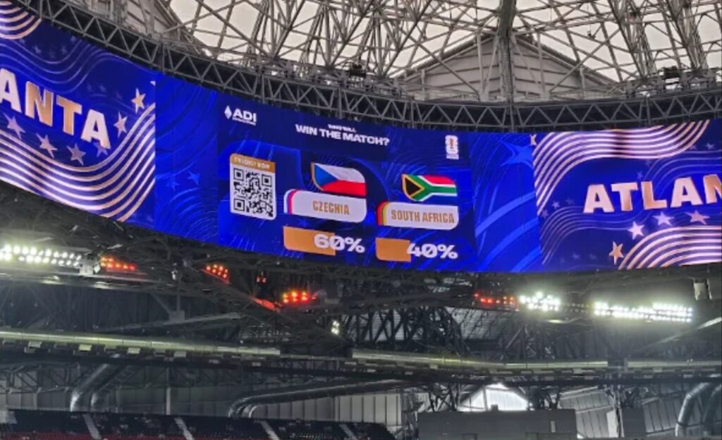 Suasana pertandingan event olahraga dunia 2026 dengan stadion penuh penonton dan atlet berkompetisi